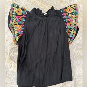 Black and vibrant multi colored stitched top